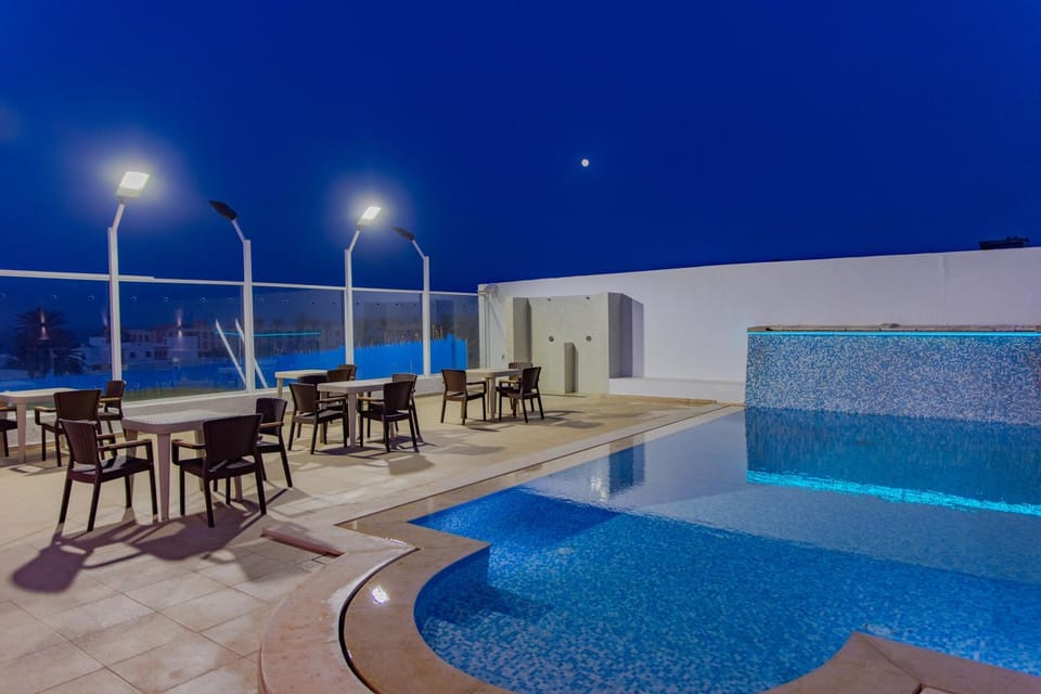 Night, Seating area, Pool view, Swimming pool