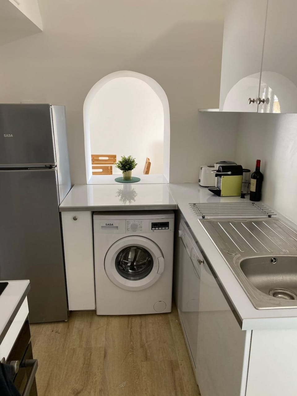 Kitchen or kitchenette, dishwasher, oven, stove, washing machine