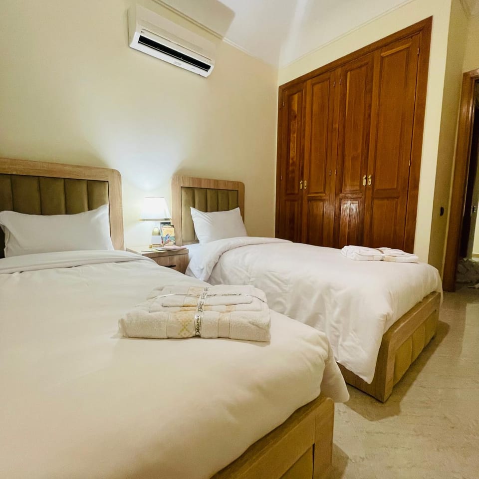 Bed, Photo of the whole room, Bedroom, towels, air conditioner