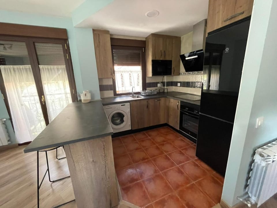 Kitchen or kitchenette, dishwasher, stove, toaster, washing machine