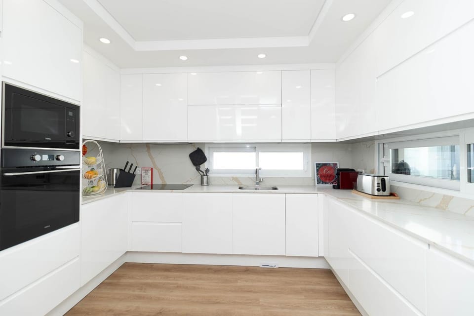 Kitchen or kitchenette, dishwasher, oven, stove