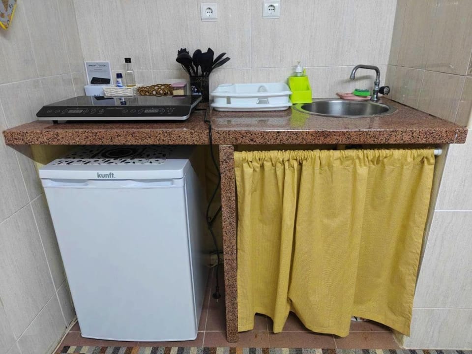 Kitchen or kitchenette, stove, kitchen