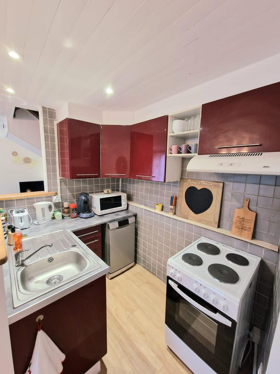 Kitchen or kitchenette, dishwasher, oven, stove, toaster