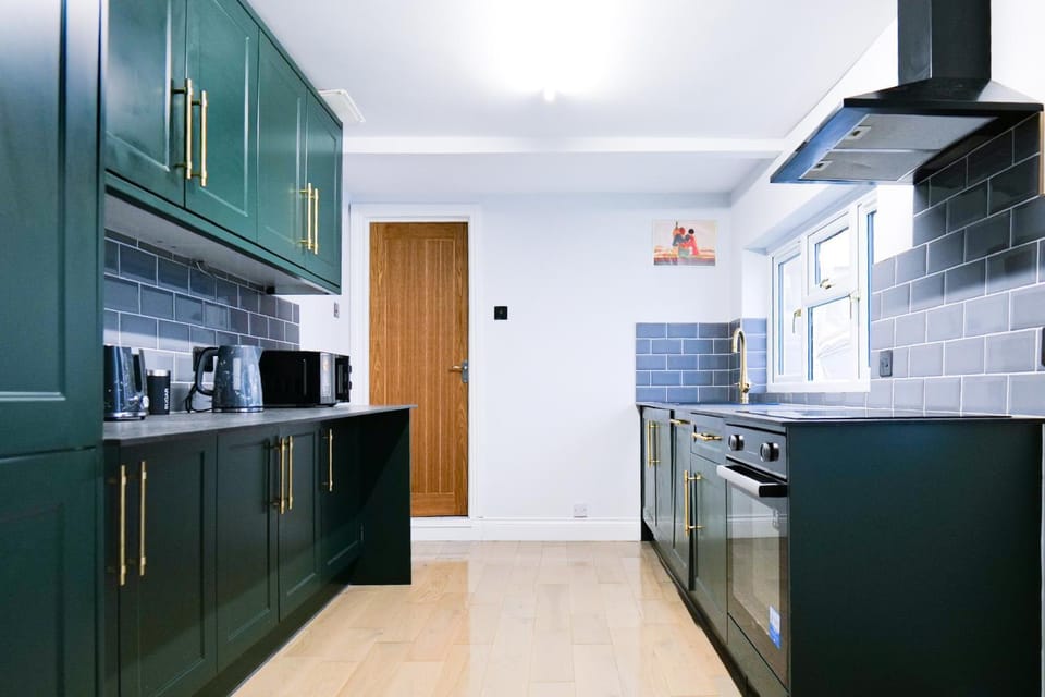 Kitchen or kitchenette, dishwasher, oven, stove