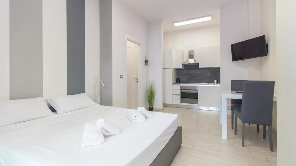 Bed, TV and multimedia, Kitchen or kitchenette, Living room, Photo of the whole room, Seating area, Dining area, Bedroom, stove