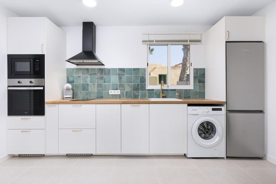 Kitchen or kitchenette, dishwasher, oven, stove, washing machine