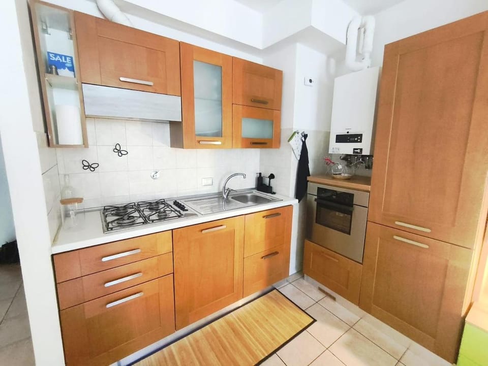 Kitchen or kitchenette, dishwasher, oven, stove