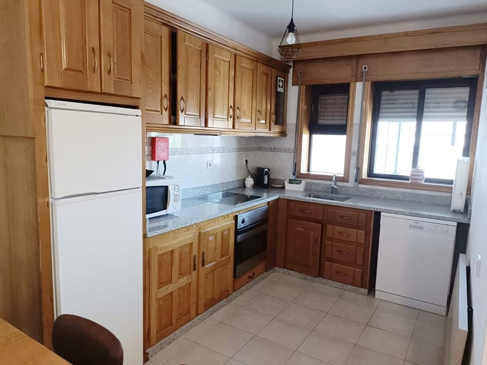 Kitchen or kitchenette, dishwasher, oven, stove