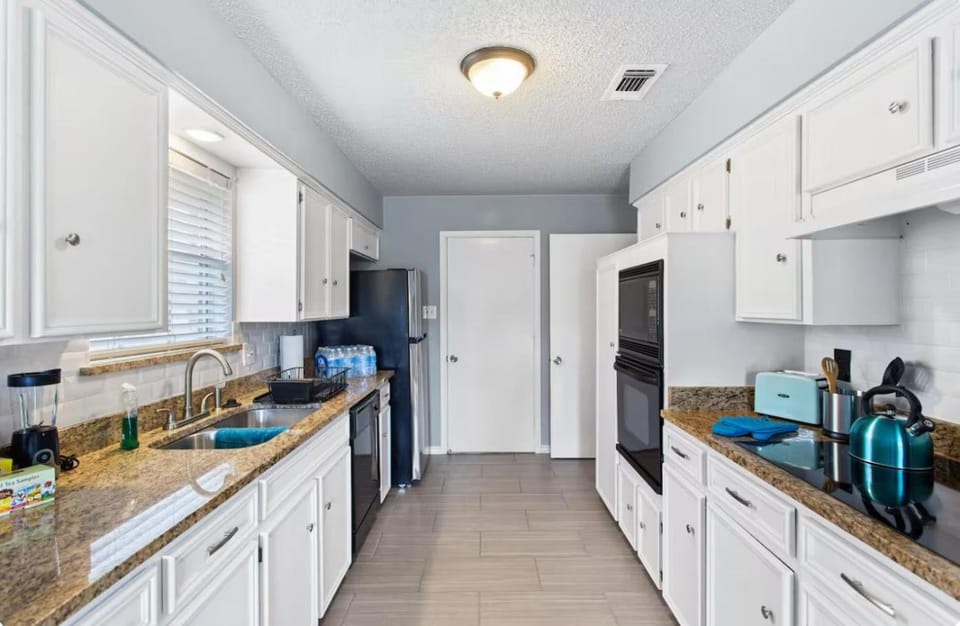 Kitchen or kitchenette, dishwasher, oven, stove, toaster