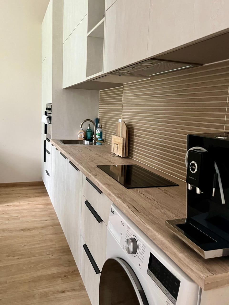 Kitchen or kitchenette, dishwasher, stove, washing machine