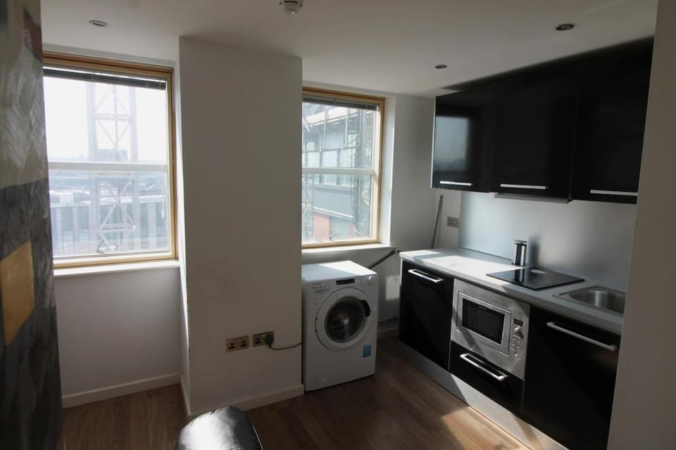 Kitchen or kitchenette, oven, stove, washing machine, dryer