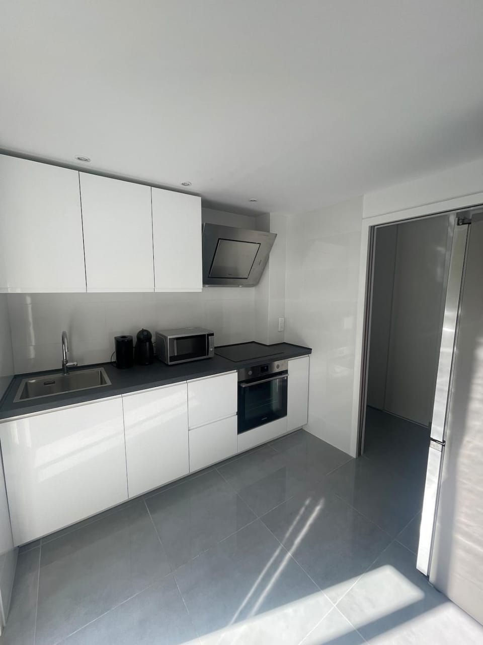 Kitchen or kitchenette, dishwasher, oven, stove