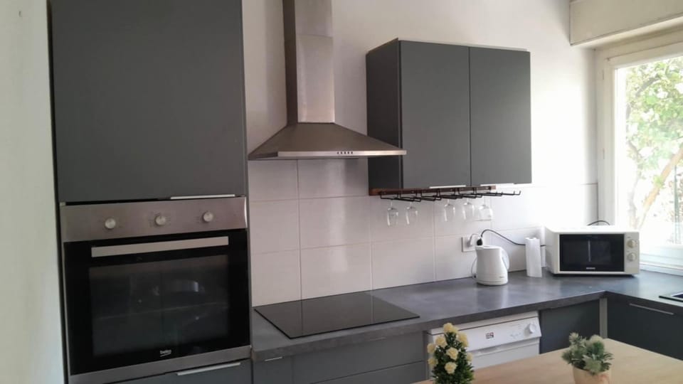 Kitchen or kitchenette, dishwasher, oven, stove