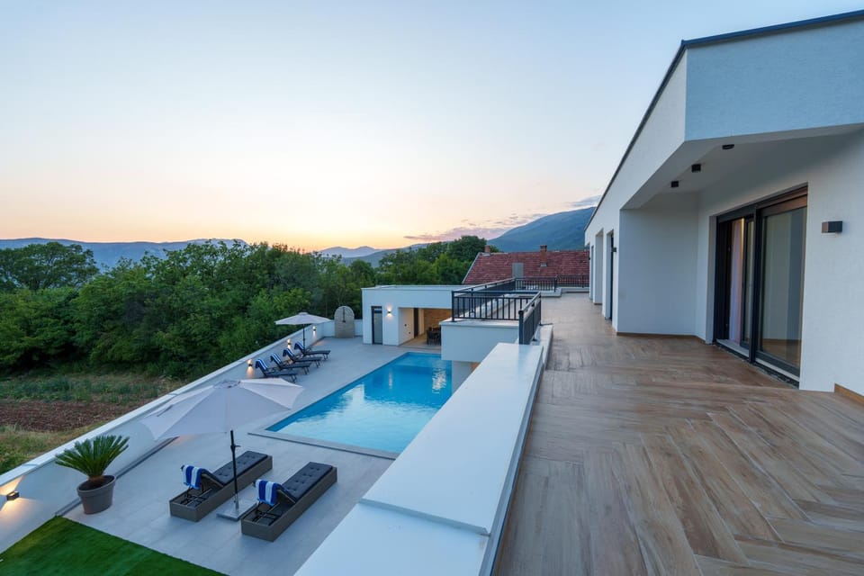 View (from property/room), Balcony/Terrace, Mountain view, Swimming pool, Sunset