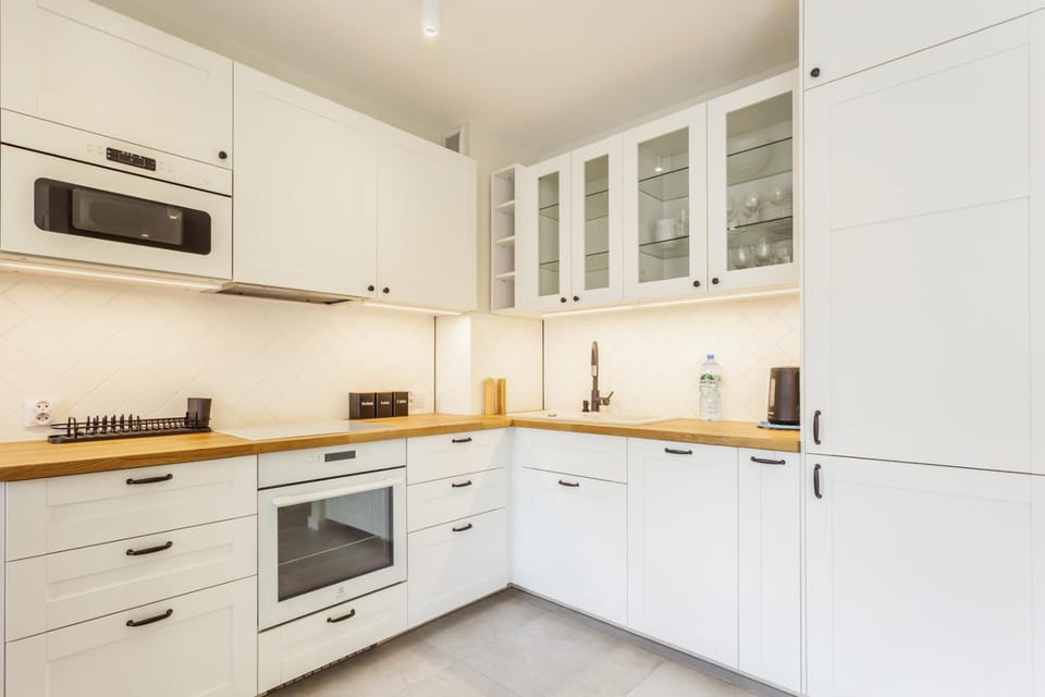 Kitchen or kitchenette, dishwasher, microwave, oven, stove
