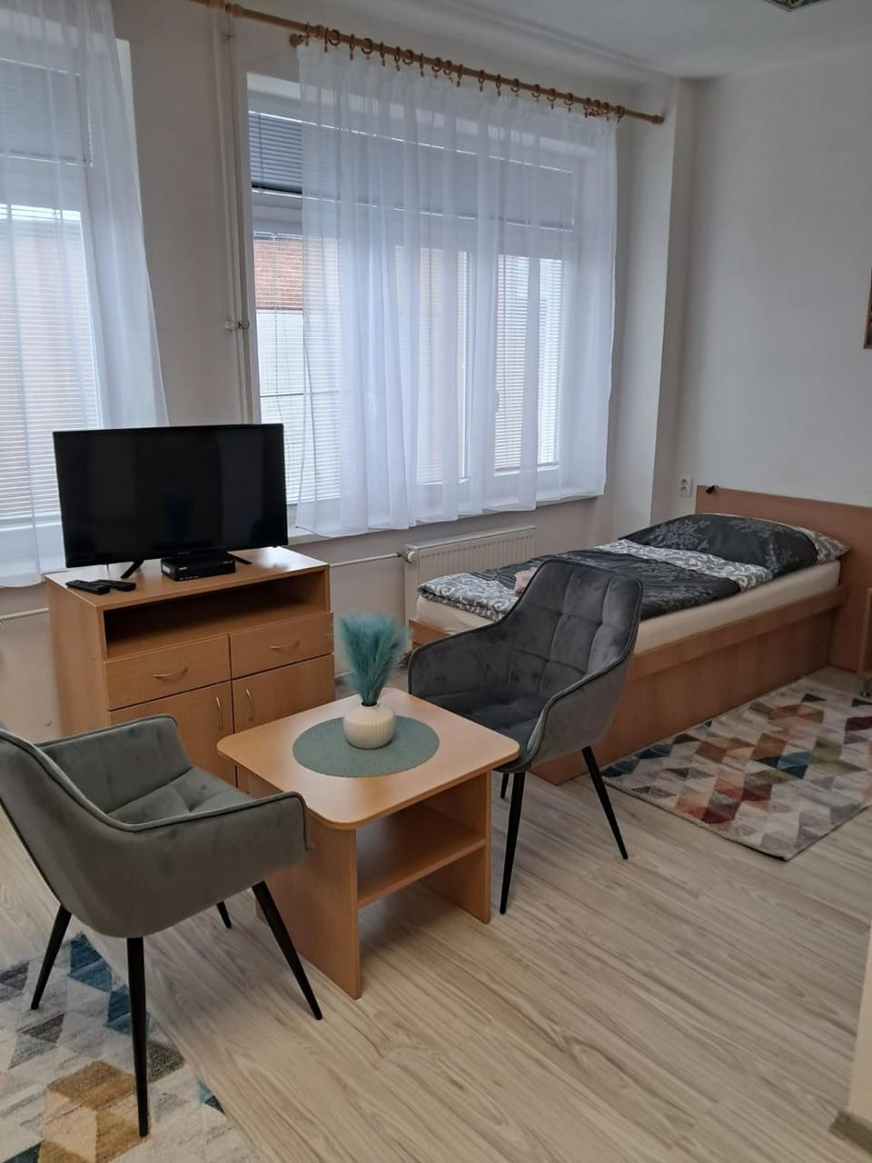 Bed, TV and multimedia, Living room, Seating area, Bedroom, towels, wardrobe