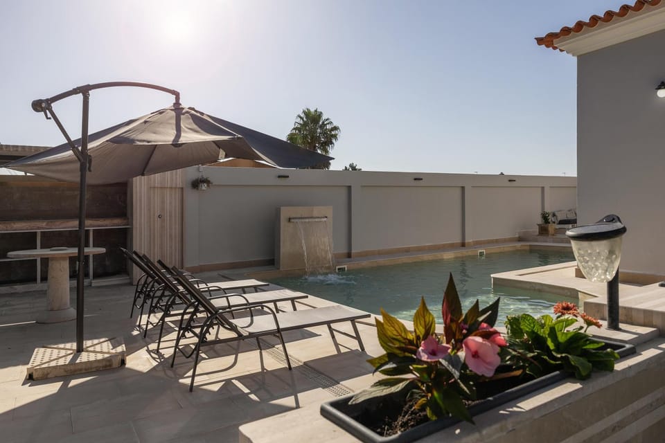 Patio, Day, Natural landscape, Pool view, Swimming pool, sunbed