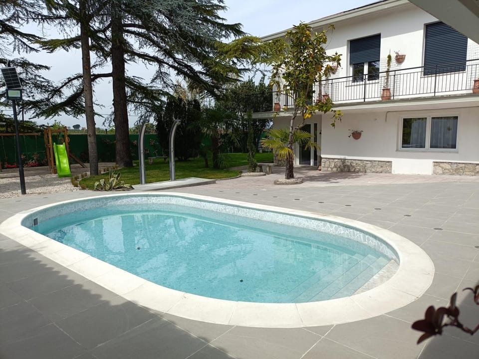 Property building, Living room, Swimming pool