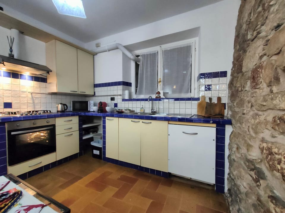 Kitchen or kitchenette, dishwasher, oven, stove, laundry, washing machine