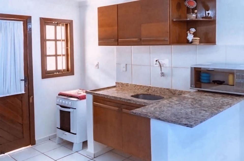 Kitchen or kitchenette, microwave, stove, laundry