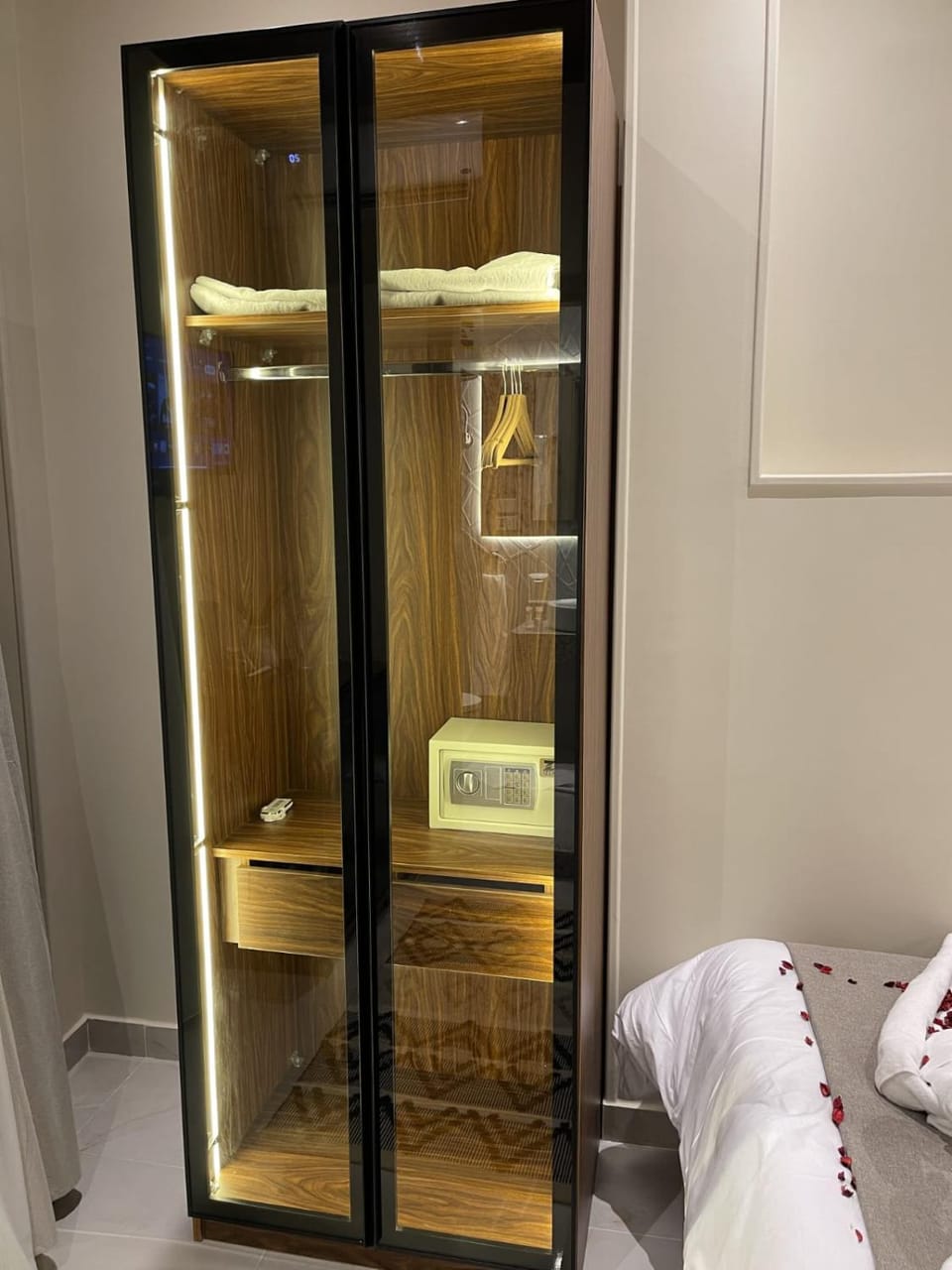 Bed, towels, wardrobe