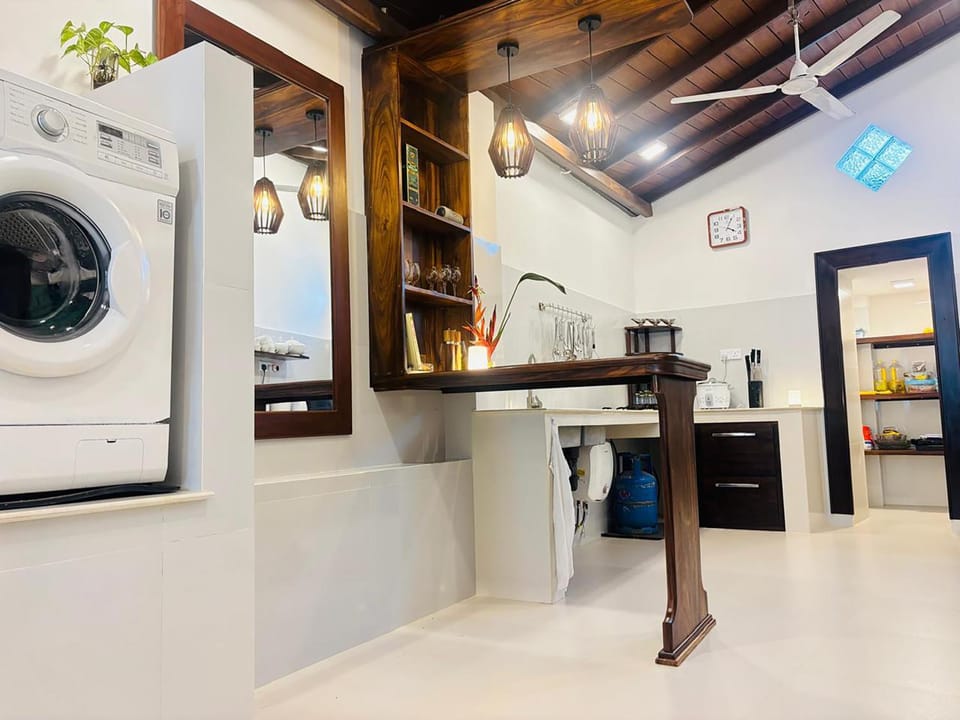 Kitchen or kitchenette, oven, stove, washing machine