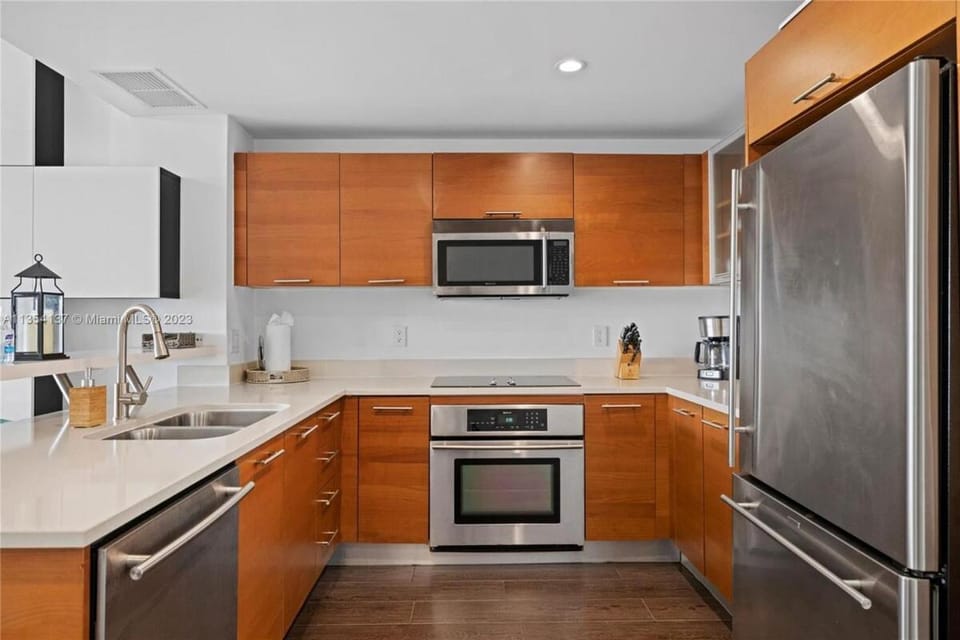 Kitchen or kitchenette, dishwasher, oven, stove