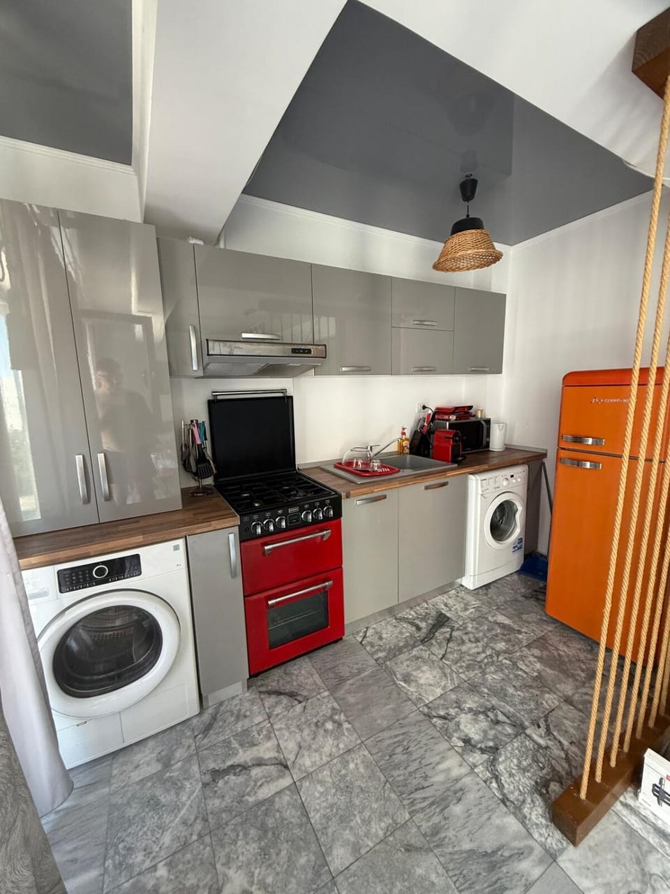 Kitchen or kitchenette, oven, stove, toaster, washing machine, dryer