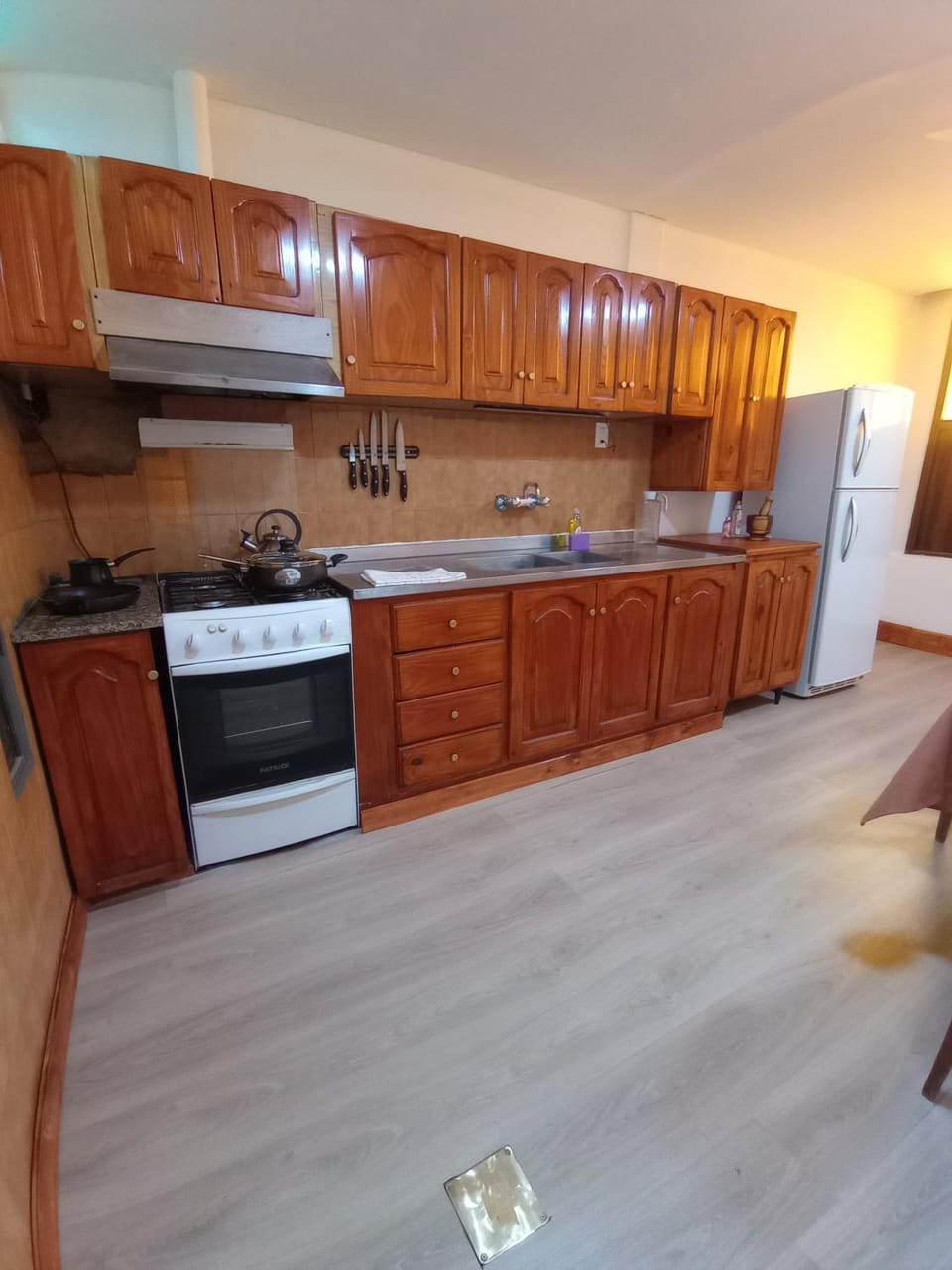 Kitchen or kitchenette, dishwasher, oven, stove