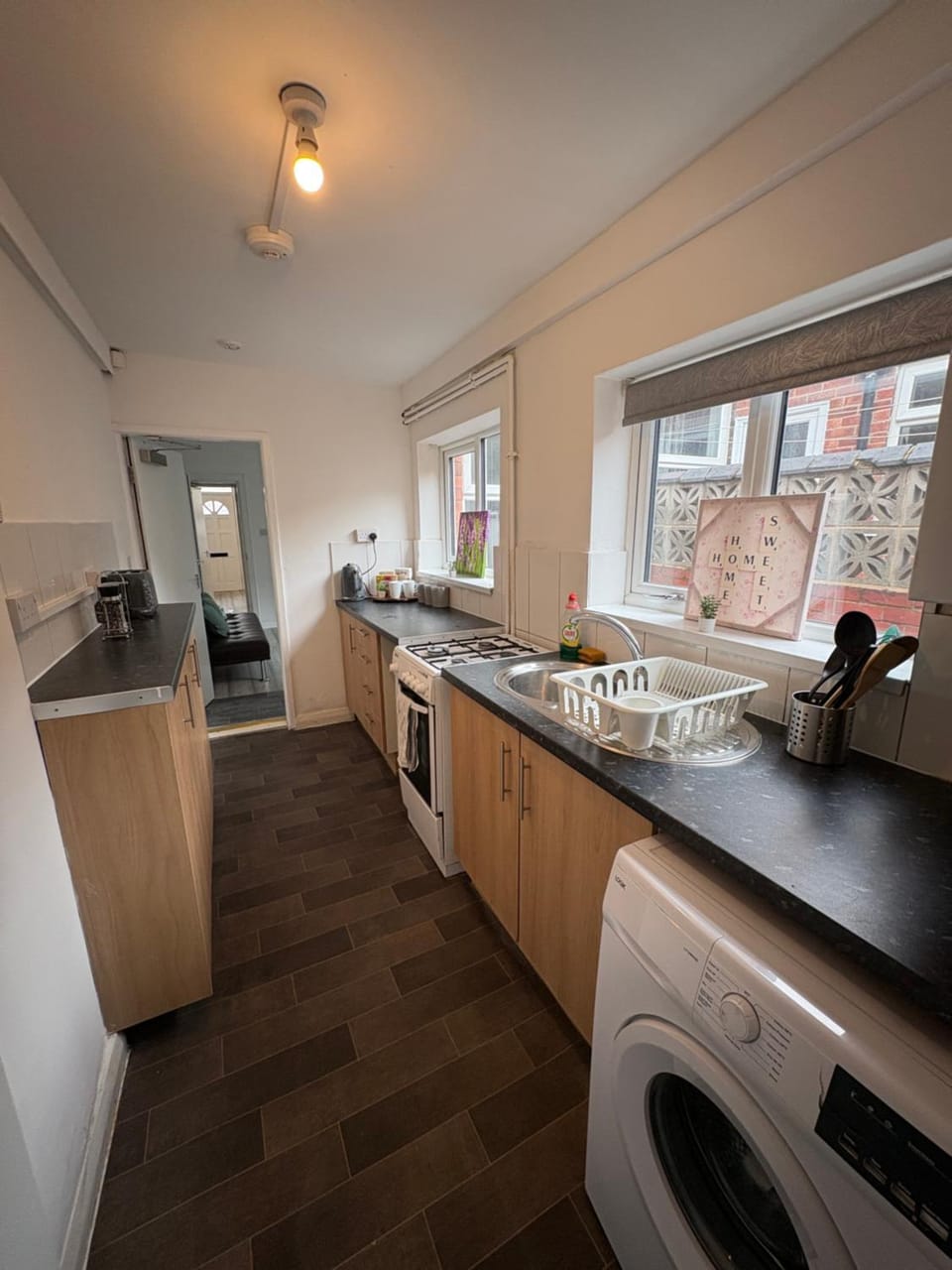 Kitchen or kitchenette, oven, stove, washing machine