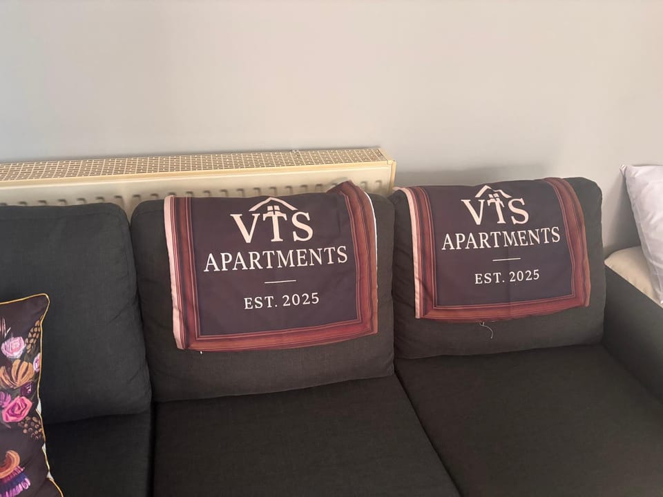 Property logo or sign, Living room, Seating area, Text overlay