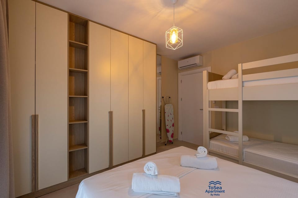 Bed, Photo of the whole room, Bedroom, bunk bed, towels, wardrobe, air conditioner