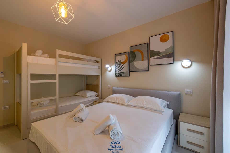 Bed, Photo of the whole room, Bedroom, bunk bed, towels, air conditioner