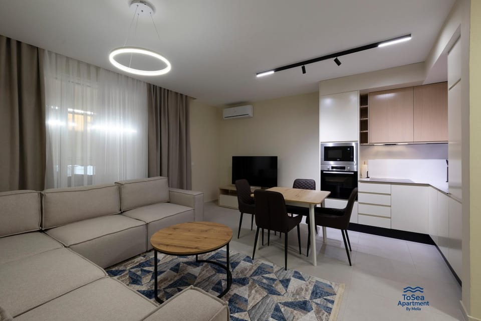 TV and multimedia, Kitchen or kitchenette, Living room, Seating area, Dining area, oven, air conditioner