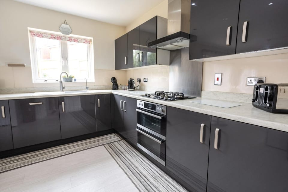Kitchen or kitchenette, dishwasher, oven, stove, toaster