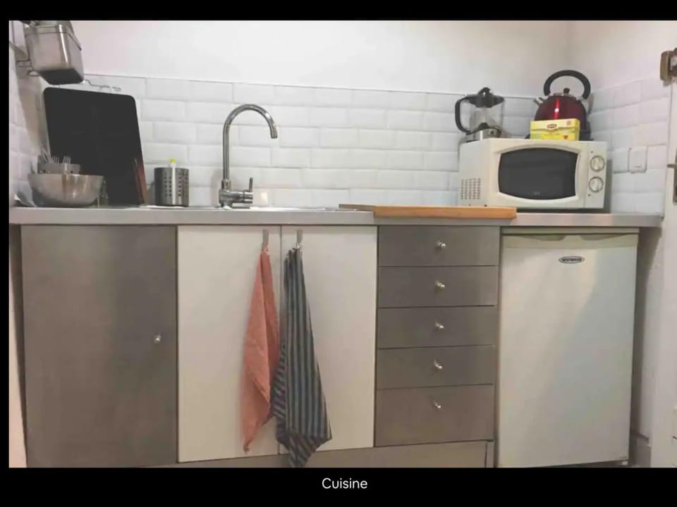 Kitchen or kitchenette, stove, toaster