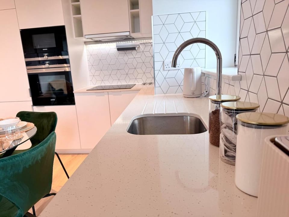 Kitchen or kitchenette, dishwasher, microwave, oven, stove, toaster