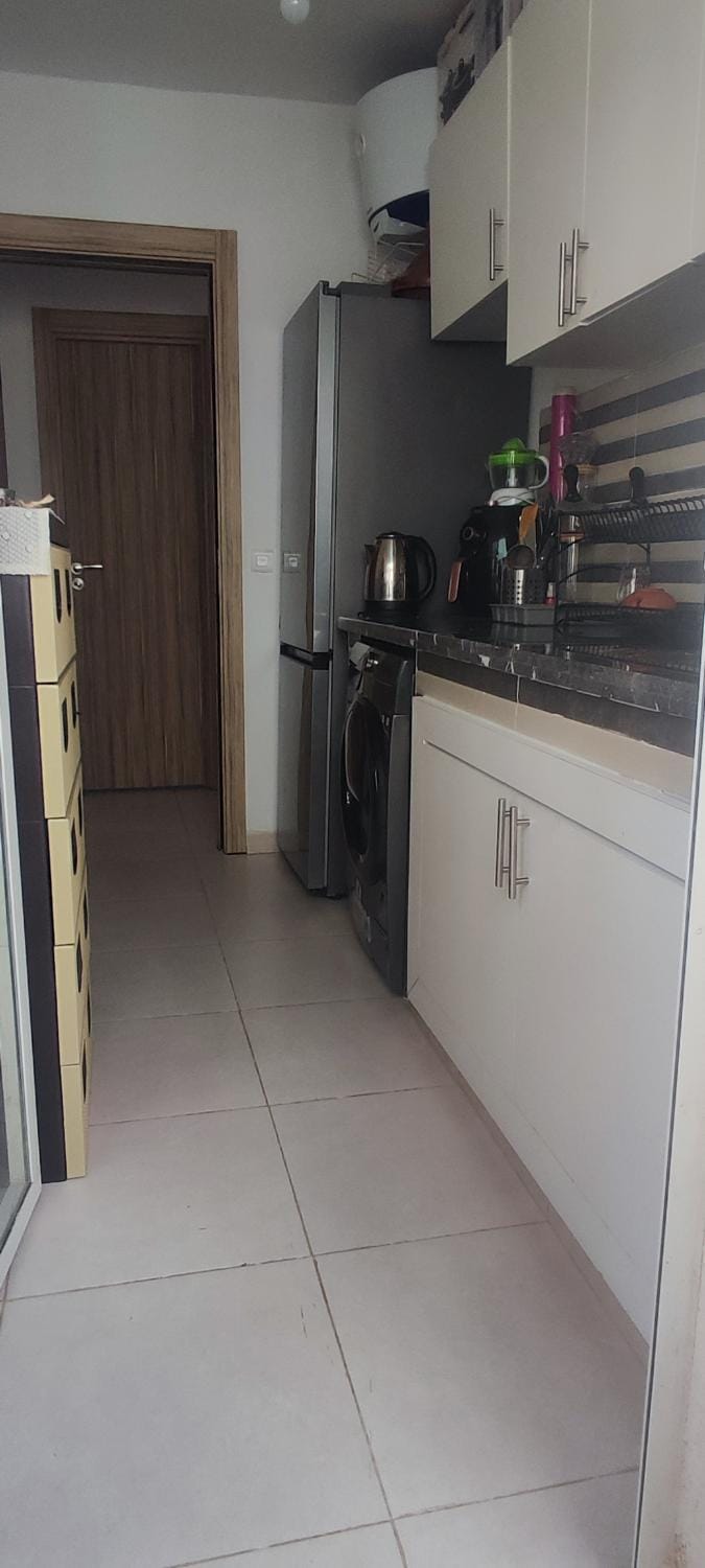 Kitchen or kitchenette, dishwasher, oven, stove