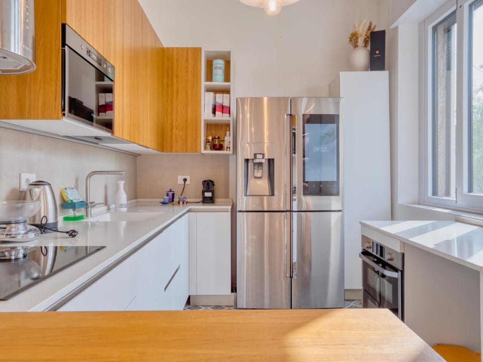 Kitchen or kitchenette, dishwasher, oven, stove