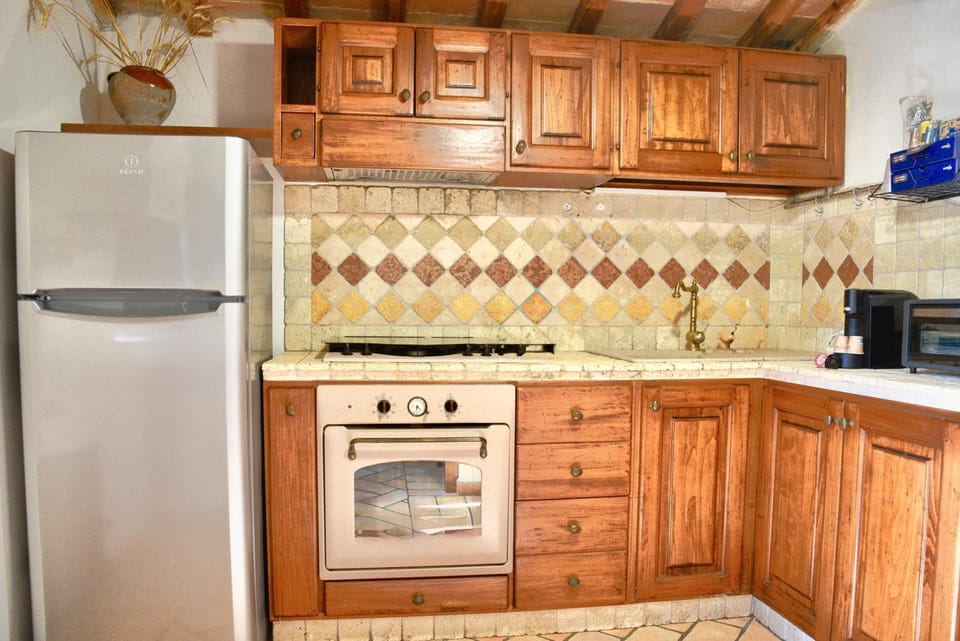 Kitchen or kitchenette, oven, stove, toaster