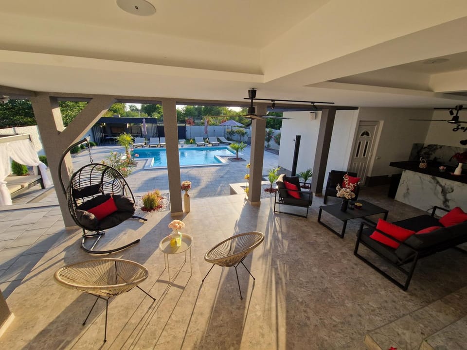 Patio, Seating area, Pool view, Swimming pool, sunbed