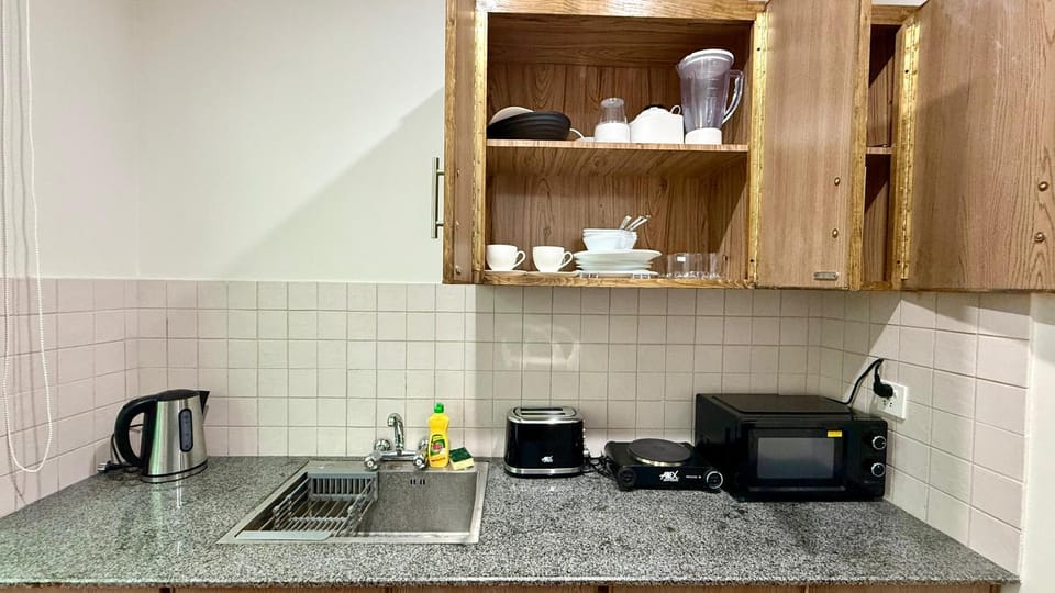 Kitchen or kitchenette, stove, toaster