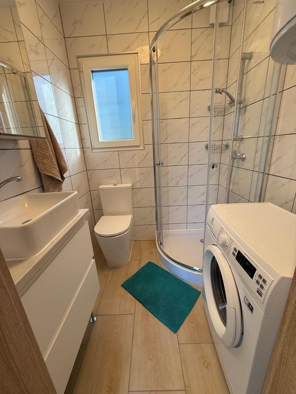 Shower, Toilet, Bathroom, towels, washing machine, dryer