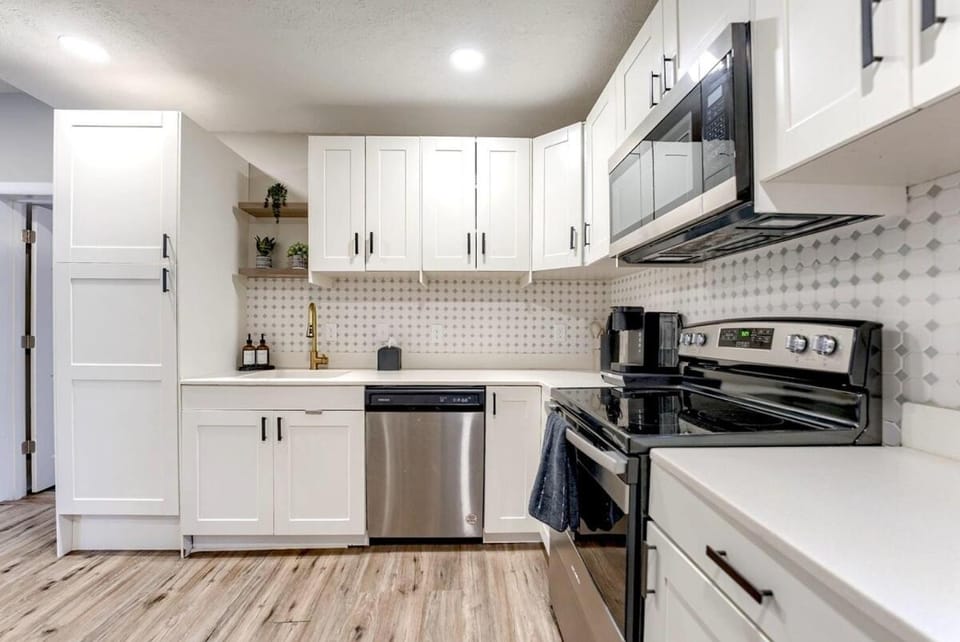 Kitchen or kitchenette, dishwasher, oven, stove, toaster