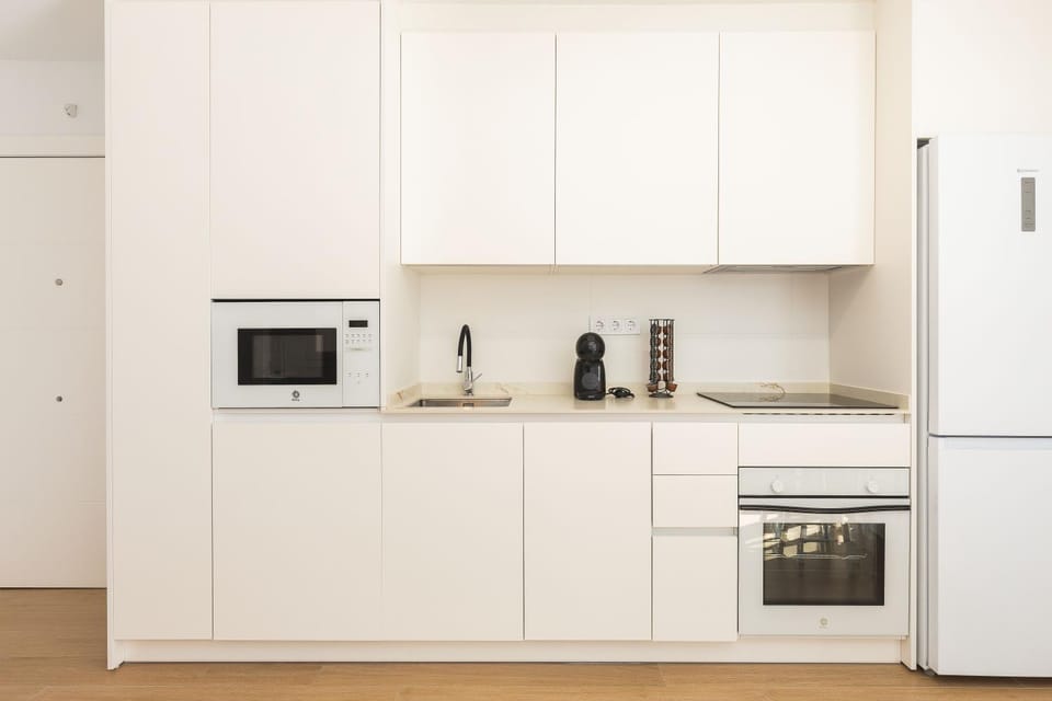 Kitchen or kitchenette, dishwasher, microwave, oven, stove, washing machine, dryer