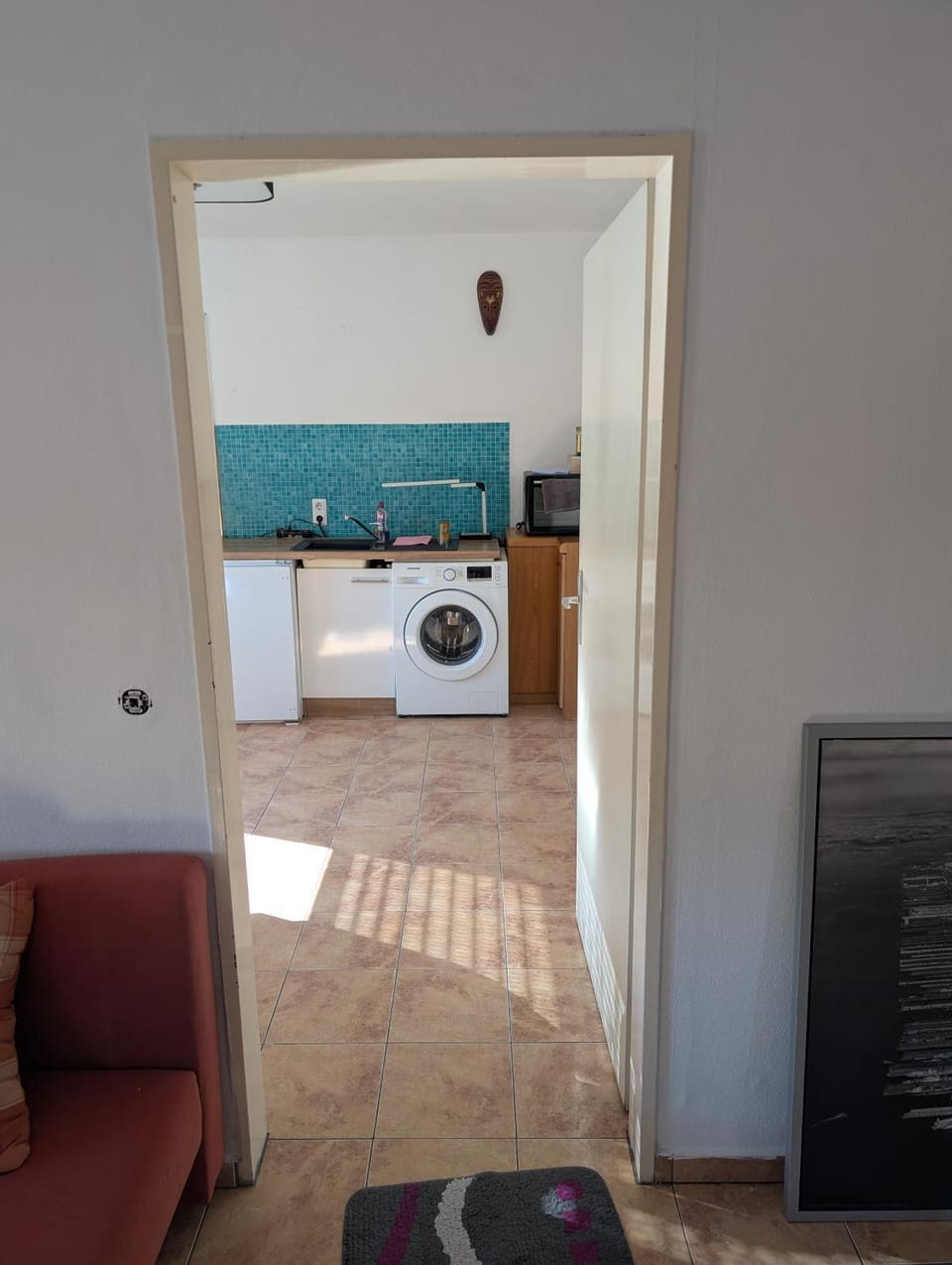 Kitchen or kitchenette, washing machine