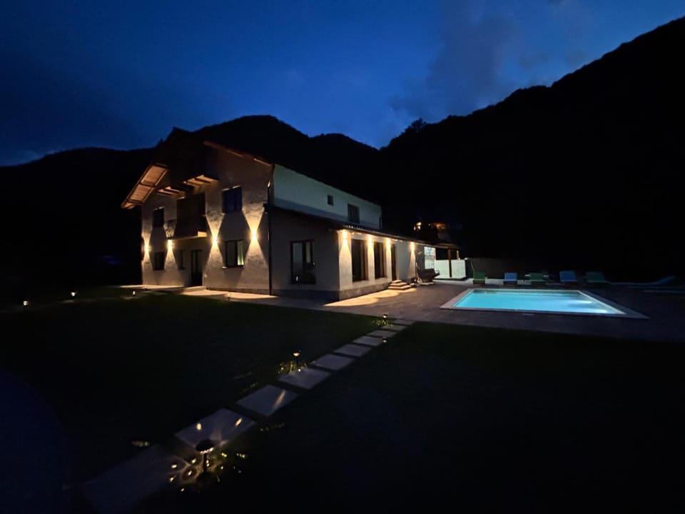 Property building, Night, Natural landscape, Mountain view, Pool view, Swimming pool