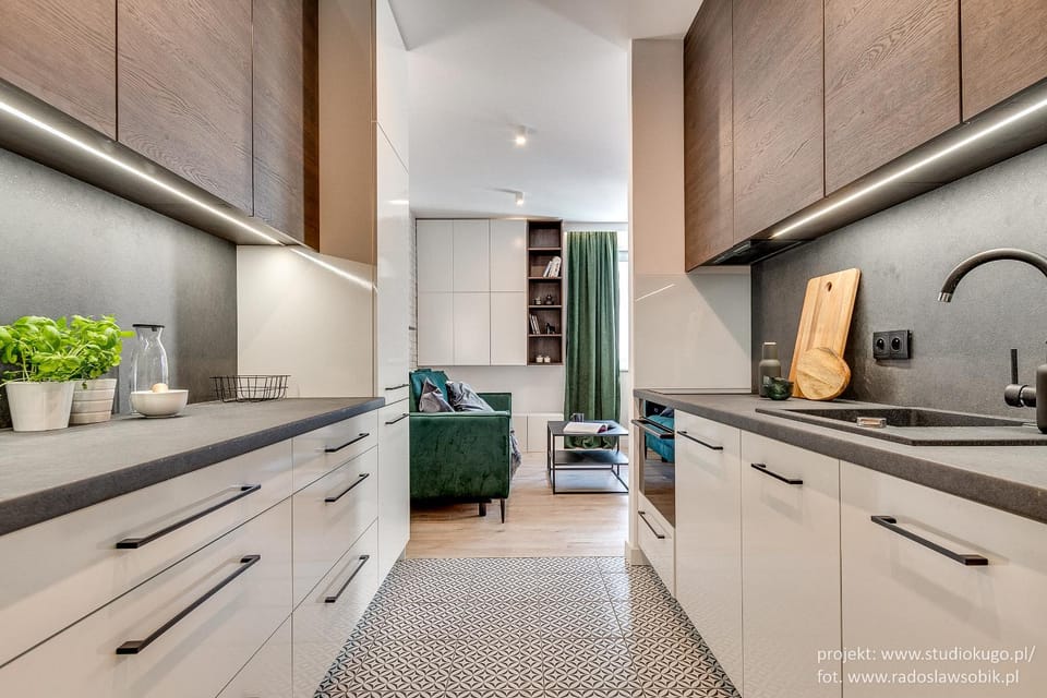 Kitchen or kitchenette, dishwasher, oven, stove