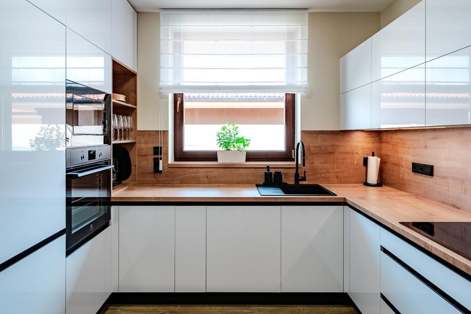 Kitchen or kitchenette, dishwasher, oven, stove