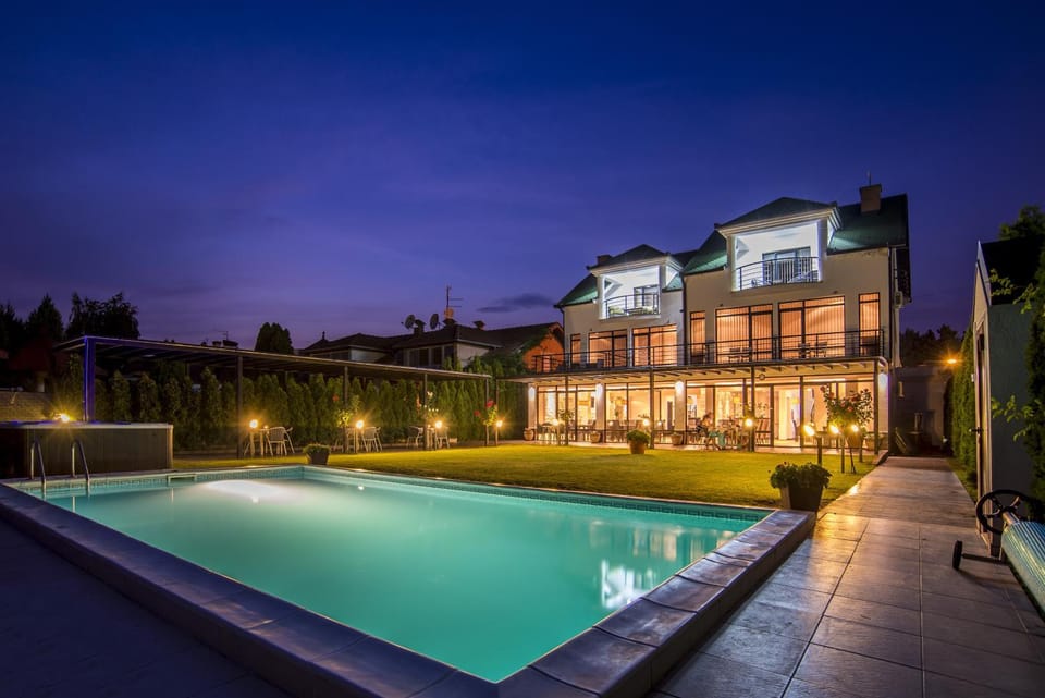 Property building, Facade/entrance, Night, Natural landscape, Children play ground, Garden, Garden view, Swimming pool, Swimming pool